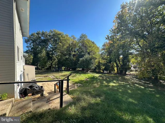 a view of a bench in the backyard