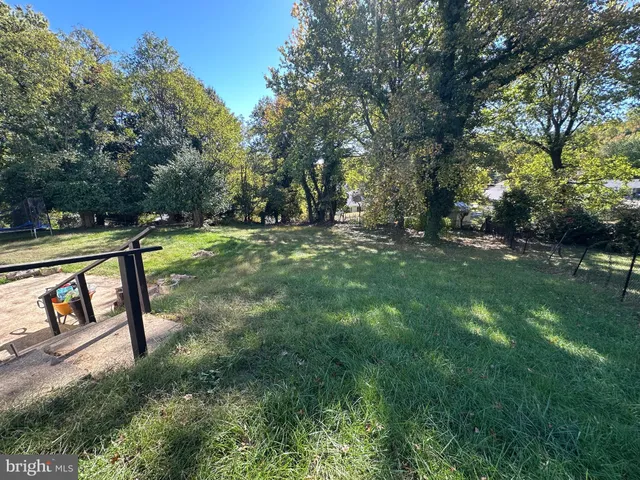 a view of a backyard with sitting area