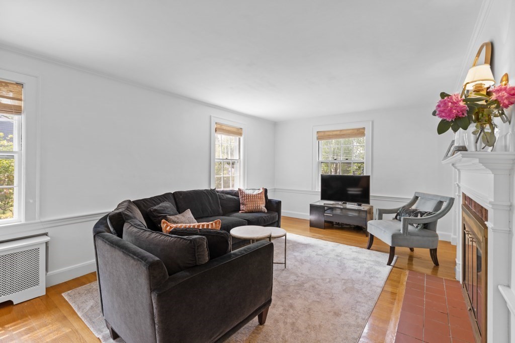 24 Pine Hill Circle Wakefield, MA 01880 - Photo 14 of 34 a living room with furniture and a flat screen tv