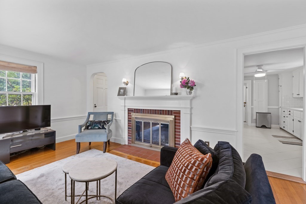 24 Pine Hill Circle Wakefield, MA 01880 - Photo 15 of 34 a living room with furniture fireplace and flat screen tv