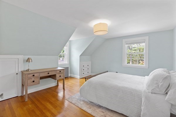 24 Pine Hill Circle Wakefield, MA 01880 - Photo 19 of 34 a spacious bedroom with a bed and a chandelier