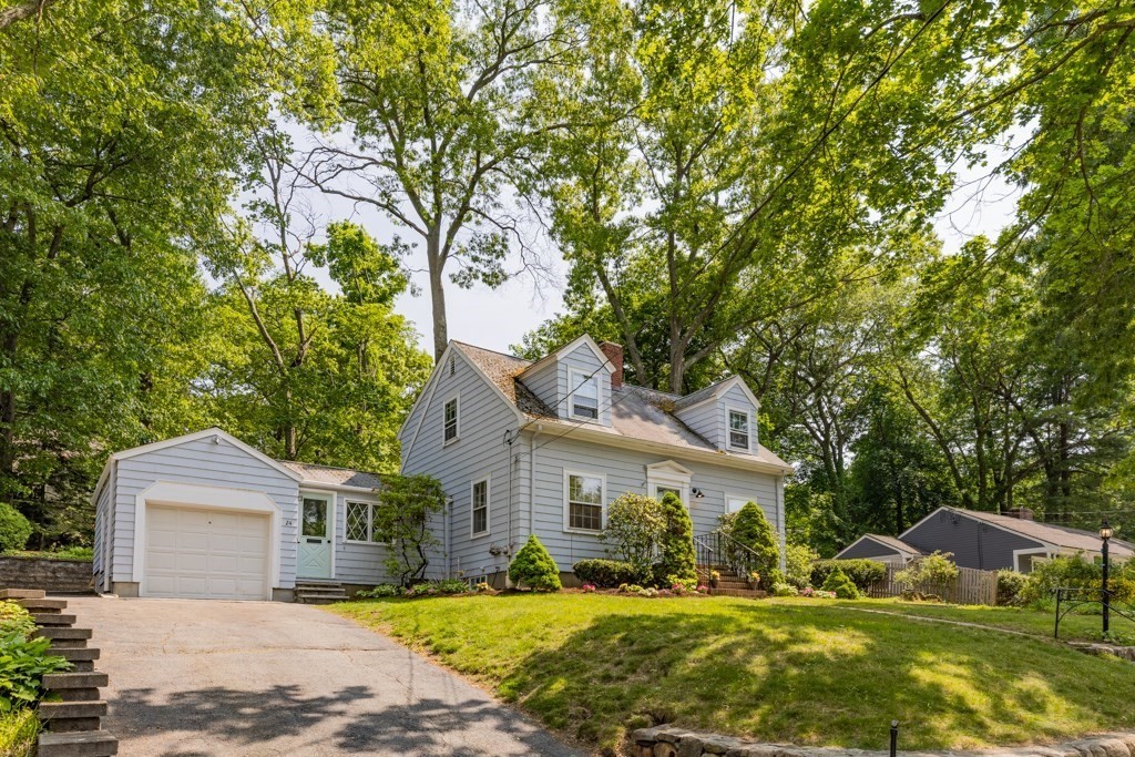 24 Pine Hill Circle Wakefield, MA 01880 - Photo 2 of 34 a front view of a house with a yard and trees