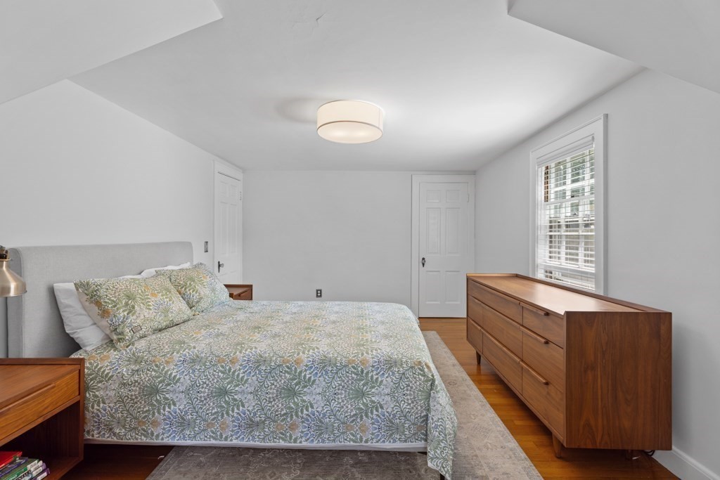 24 Pine Hill Circle Wakefield, MA 01880 - Photo 22 of 34 a bedroom with a bed and window