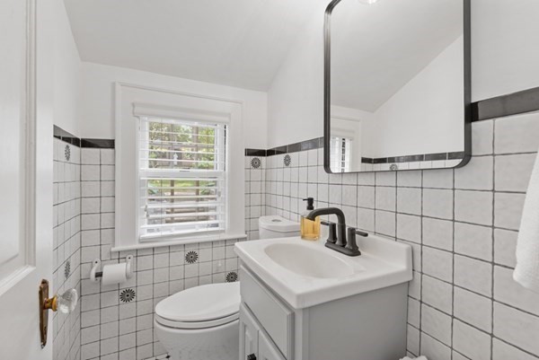 24 Pine Hill Circle Wakefield, MA 01880 - Photo 23 of 34 a bathroom with a sink a toilet and shower