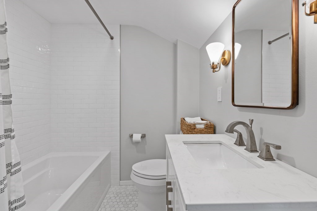 24 Pine Hill Circle Wakefield, MA 01880 - Photo 24 of 34 a bathroom with a sink toilet and bathtub