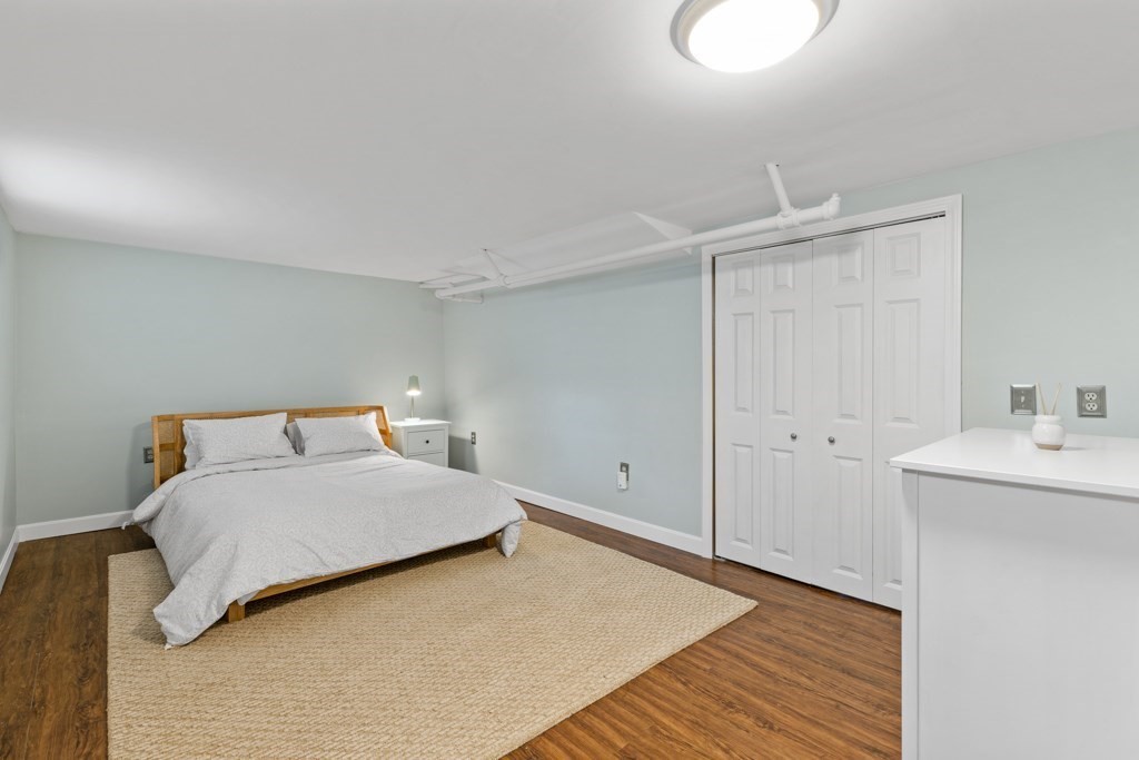 24 Pine Hill Circle Wakefield, MA 01880 - Photo 28 of 34 a bedroom with a bed and a sink