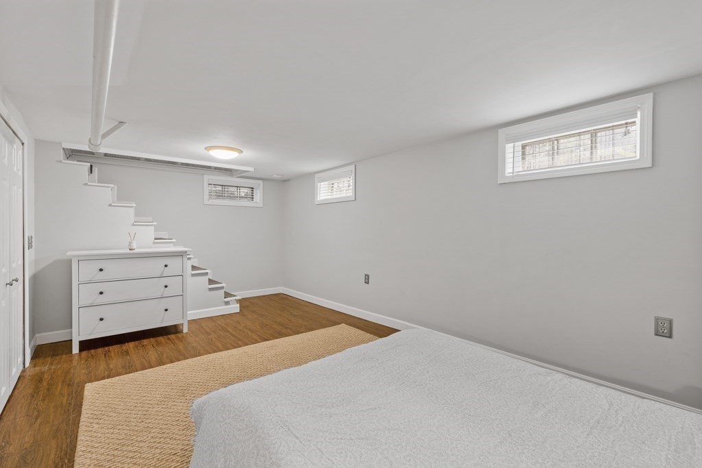 24 Pine Hill Circle Wakefield, MA 01880 - Photo 29 of 34 a bedroom with a bed and a window