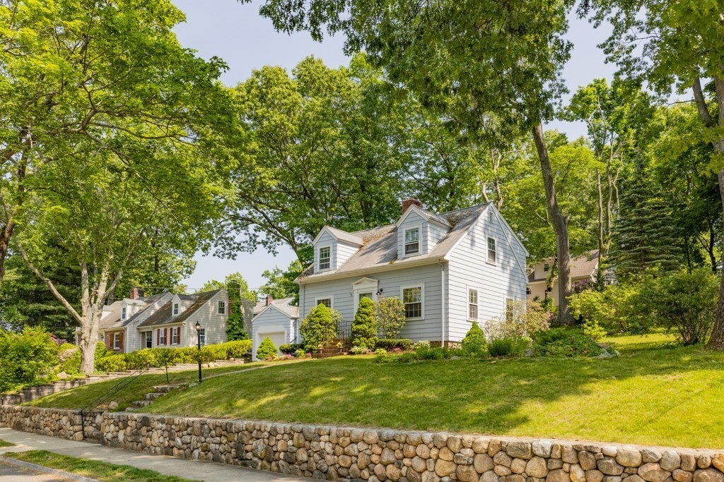 24 Pine Hill Circle Wakefield, MA 01880 - Photo 6 of 34 a view of a white house with a big yard and large trees