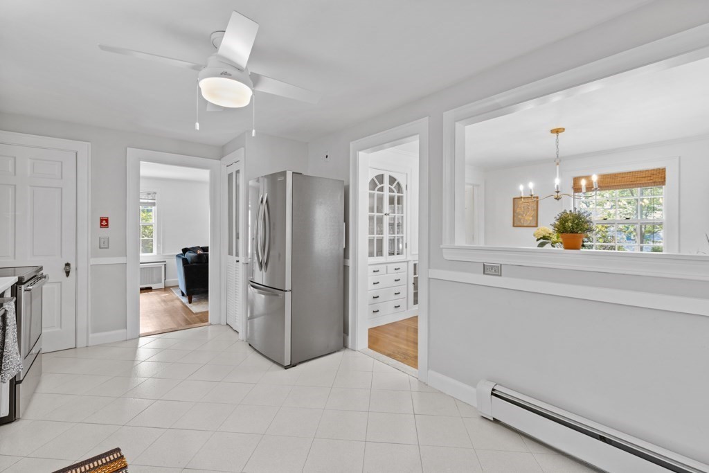 24 Pine Hill Circle Wakefield, MA 01880 - Photo 9 of 34 a kitchen with a refrigerator and microwave
