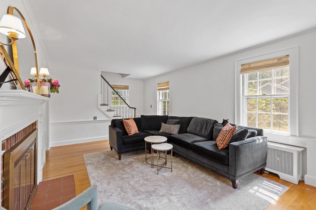 24 Pine Hill Circle Wakefield, MA 01880 - Photo 10 of 34 a living room with furniture and a fireplace