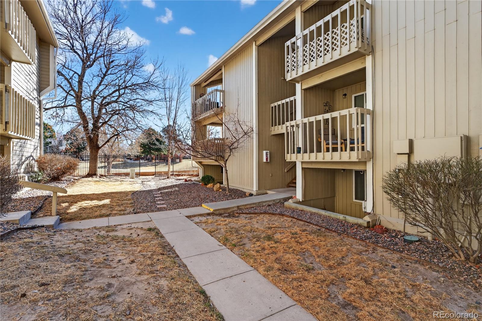 4066 South Atchison Way, Unit 101 Aurora, CO 80014 - Photo 1 of 36 a view of a house with a yard