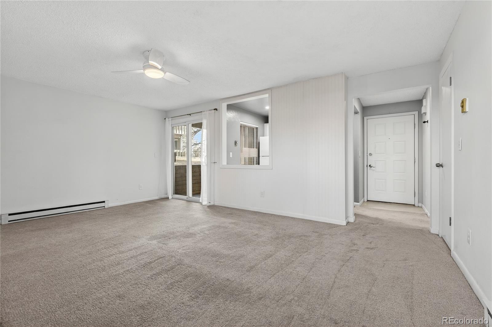 4066 South Atchison Way, Unit 101 Aurora, CO 80014 - Photo 11 of 36 a view of an empty room with a window