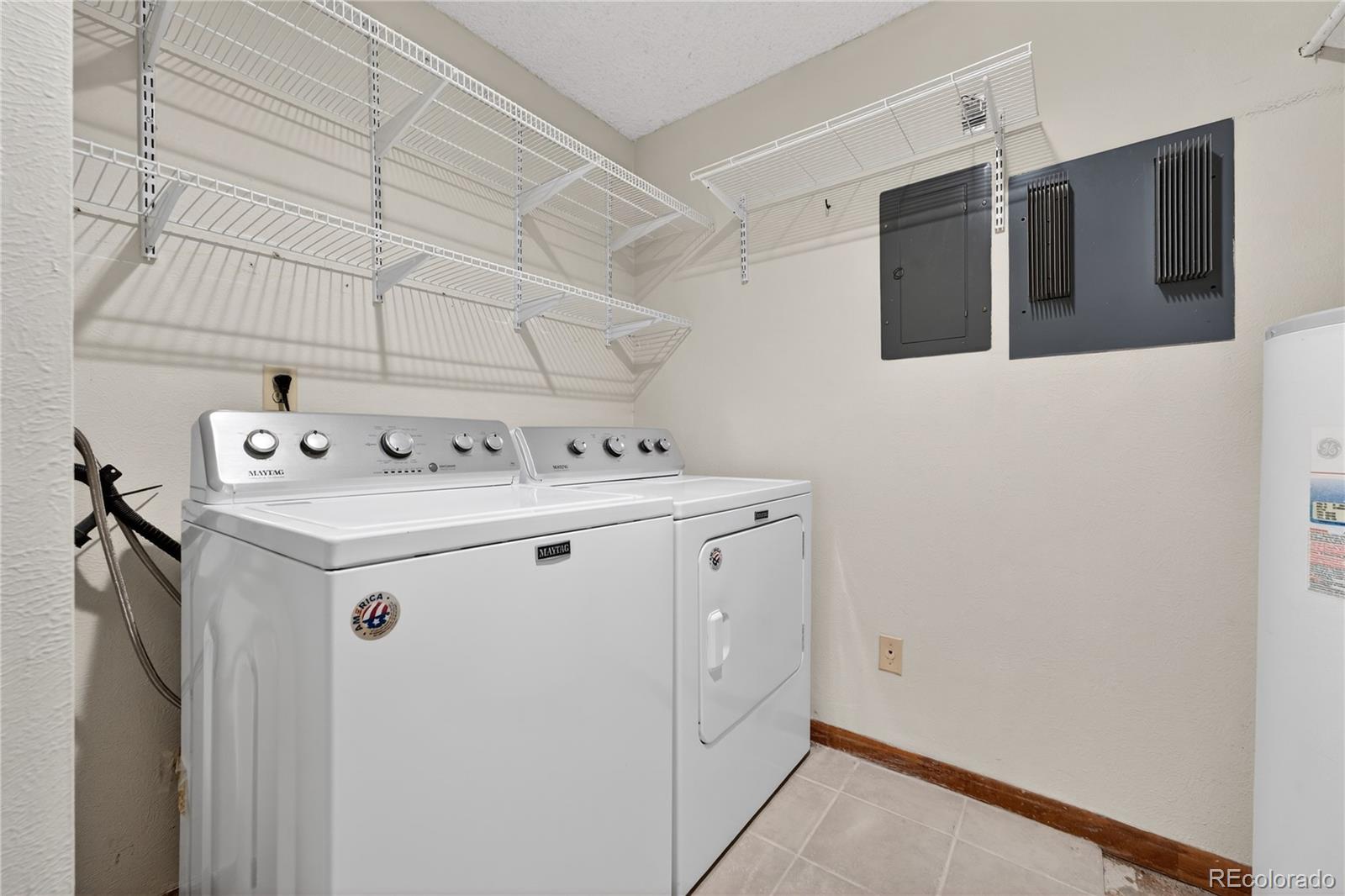4066 South Atchison Way, Unit 101 Aurora, CO 80014 - Photo 15 of 36 a utility room with dryer and washer