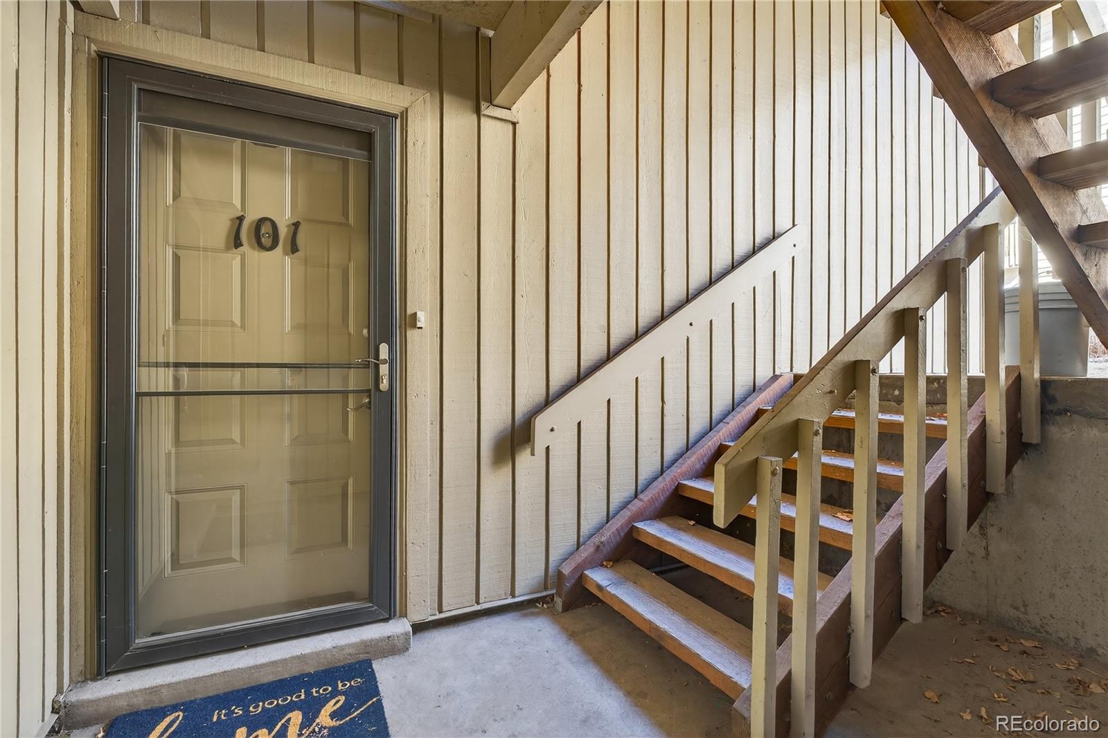 4066 South Atchison Way, Unit 101 Aurora, CO 80014 - Photo 3 of 36 a view of entryway with wooden floor and stairs