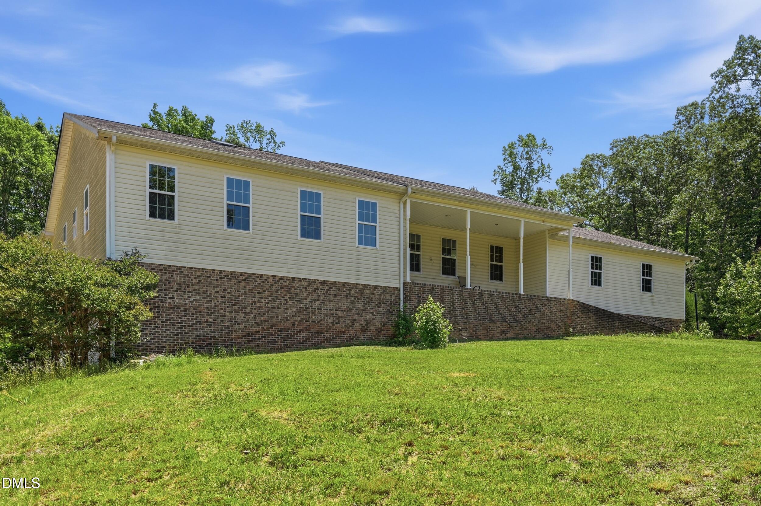 129 Shaman Drive Spring Hope, NC 27882 - Photo 6 of 43 a front view of house with yard and green space