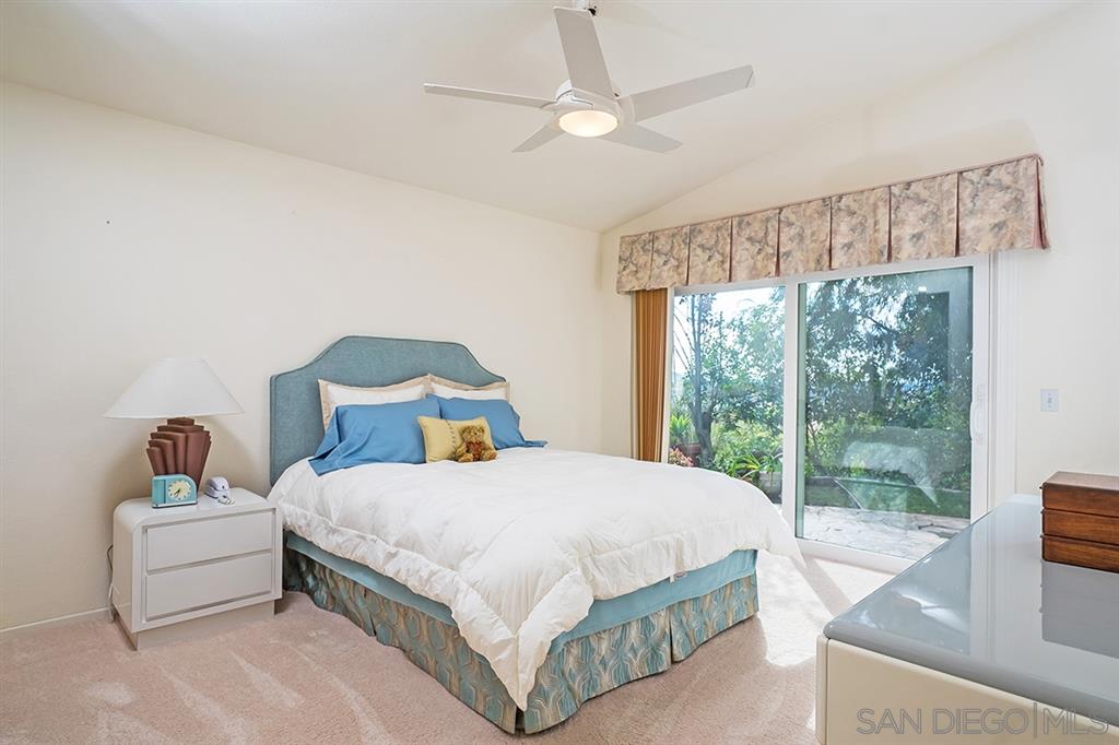 2750 Lobelia Road Alpine, CA 91901 - Photo 8 of 25 a bedroom with a bed and a large window