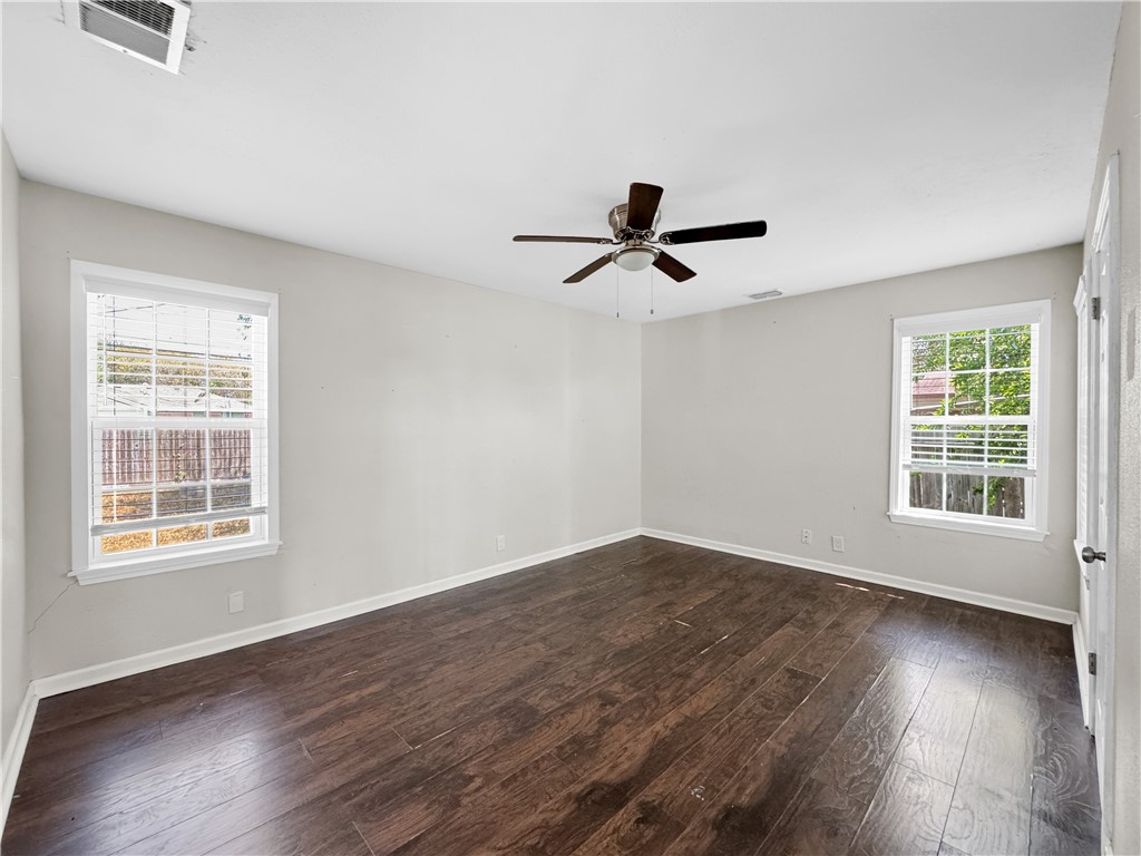 1034 Mc Clendon Street Corpus Christi, TX 78404 - Photo 12 of 19 a view of a big room with wooden floor and windows
