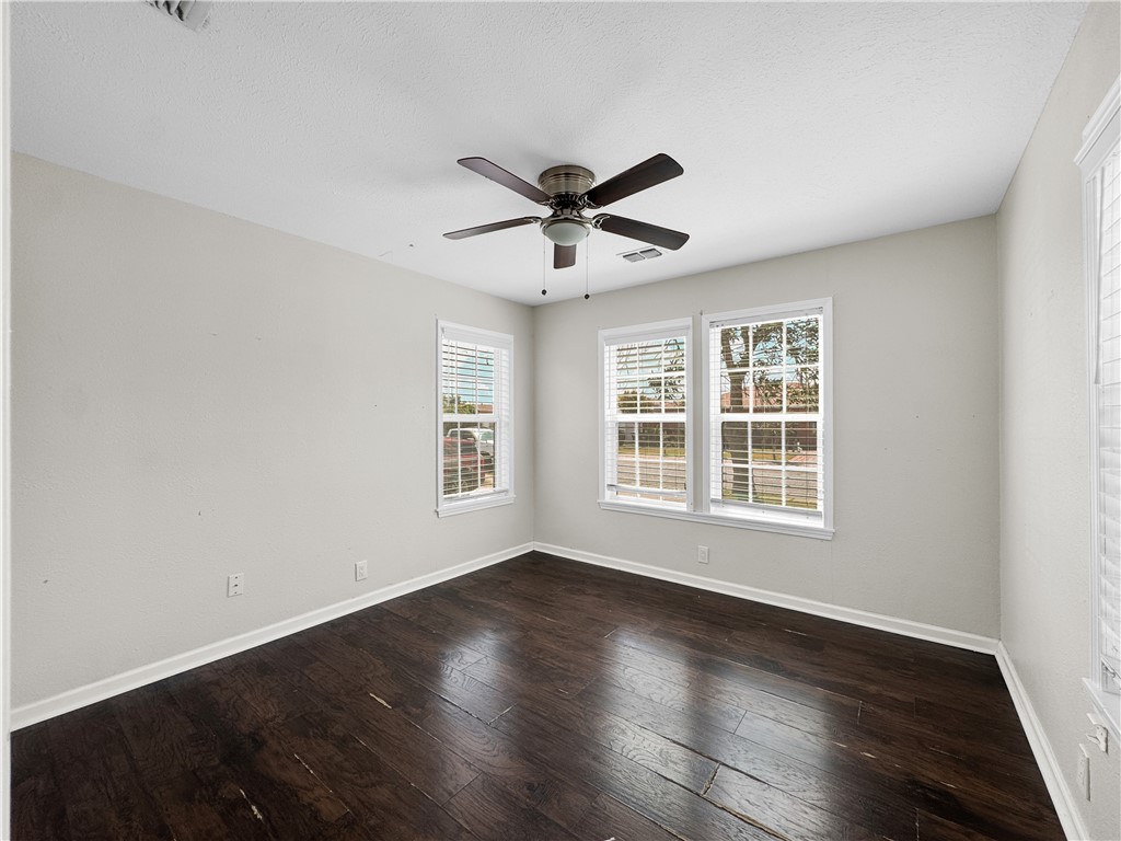 1034 Mc Clendon Street Corpus Christi, TX 78404 - Photo 13 of 19 a view of a livingroom with a hardwood floor and a ceiling fan
