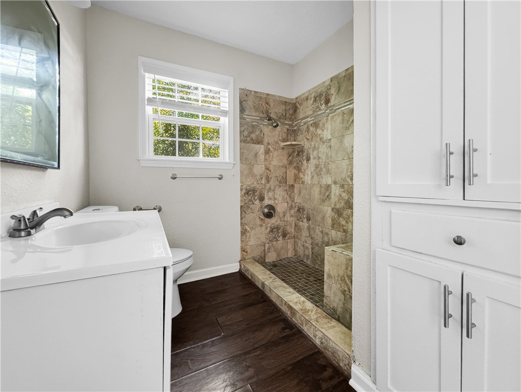 1034 Mc Clendon Street Corpus Christi, TX 78404 - Photo 14 of 19 a bathroom with a sink a toilet and shower