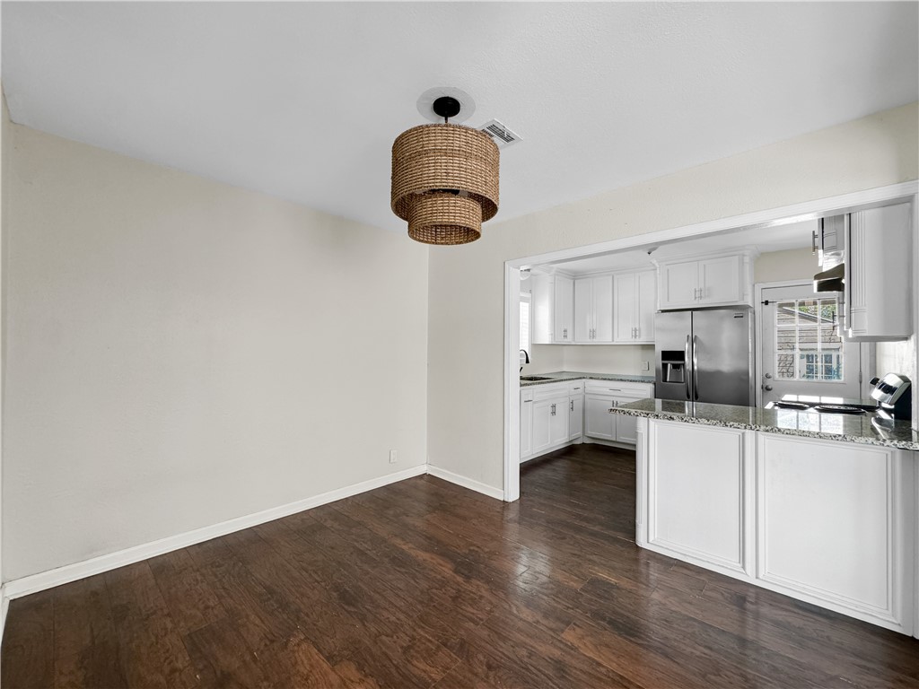 1034 Mc Clendon Street Corpus Christi, TX 78404 - Photo 7 of 19 a kitchen with a sink cabinets and wooden floor