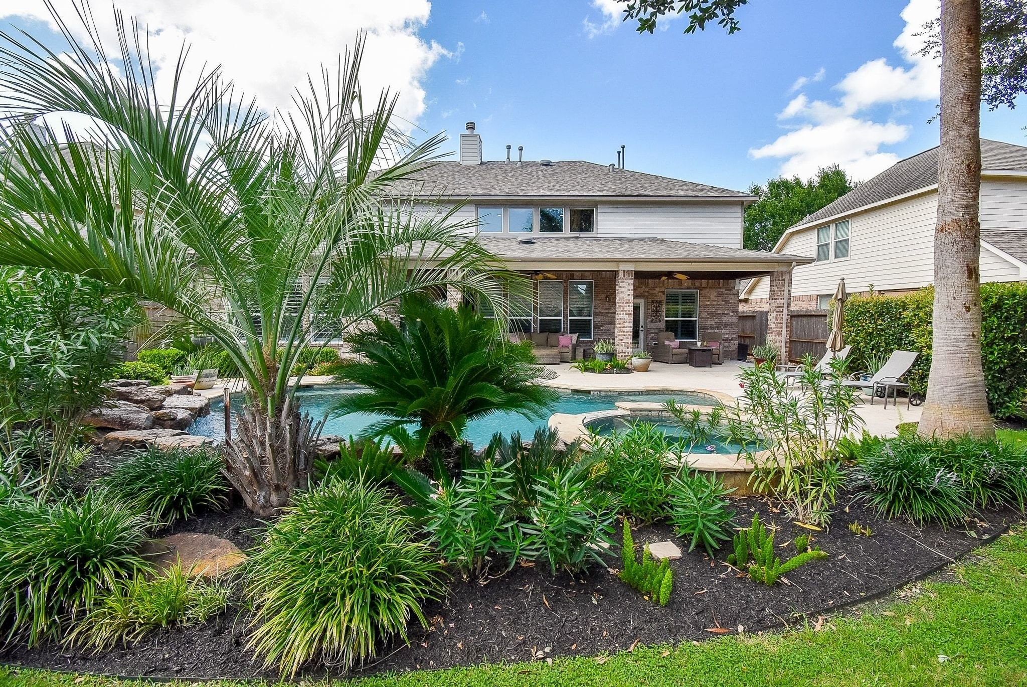 27607 Macklind Ridge Lane Katy, TX 77494 - Photo 2 of 50 Enjoy your backyard all year long. Great landscaping with plenty of decking for entertaining and green space for pets.