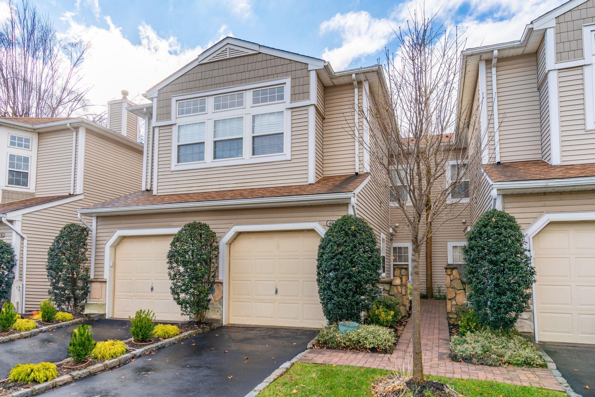 40 Sagamore Drive Plainview, NY 11803 - Photo 1 of 1 a front view of a house with garden