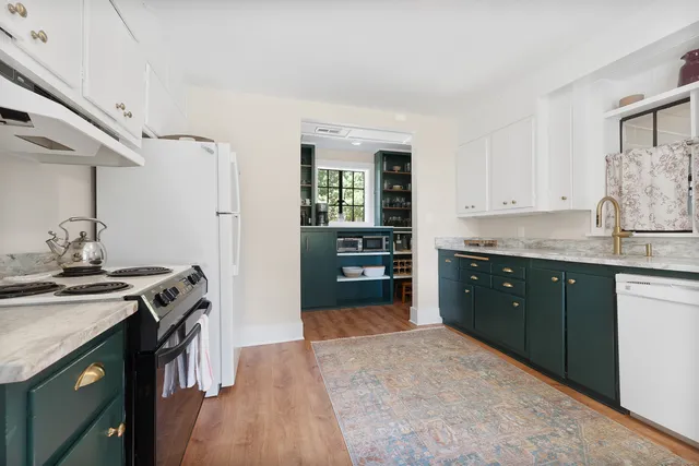 a kitchen with a stove and a sink