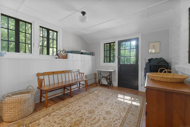 a bedroom with furniture and a window