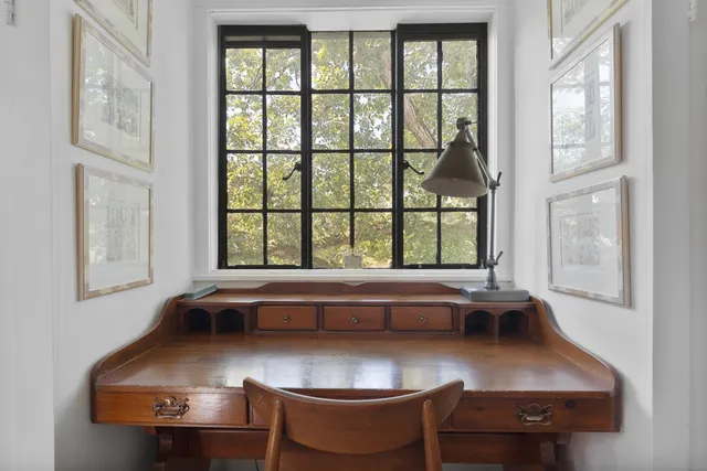 a bathroom with a sink shower and a mirror