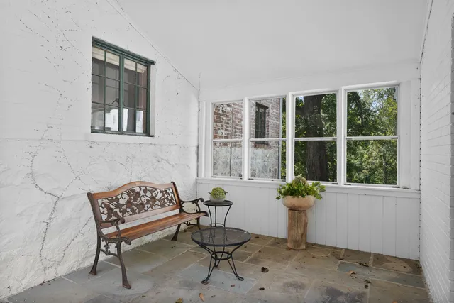 a dining room with furniture and windows
