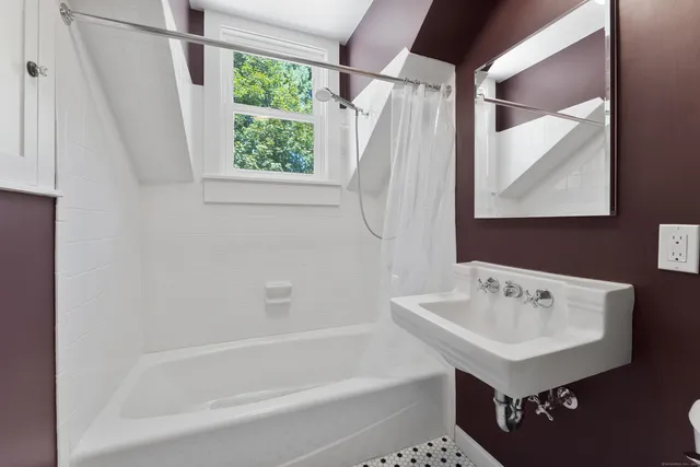 a view of a house with a tree