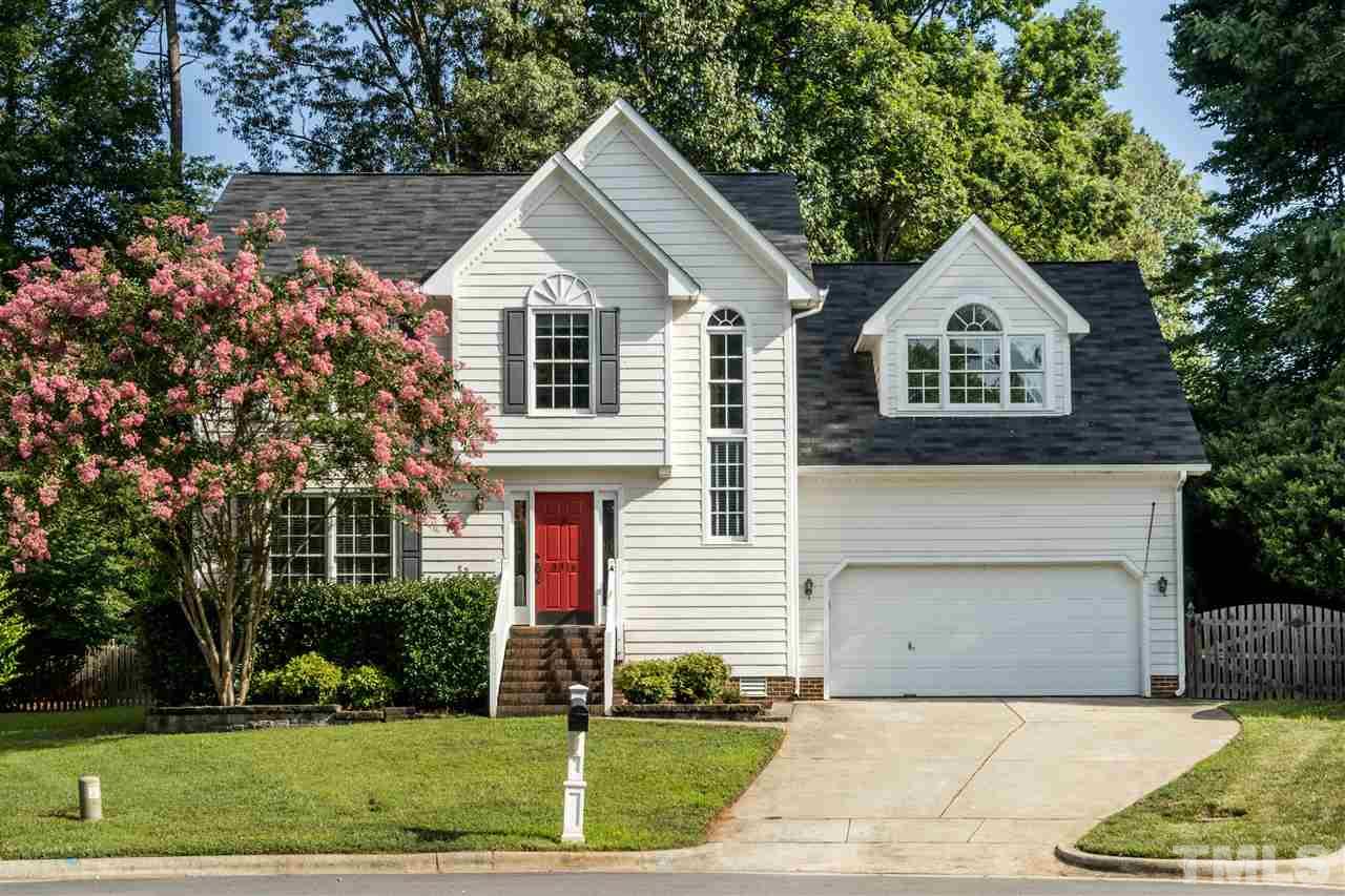 3316 Stone Castle Court Raleigh, NC 27613 - Photo 1 of 25 a front view of a house with a yard and garage