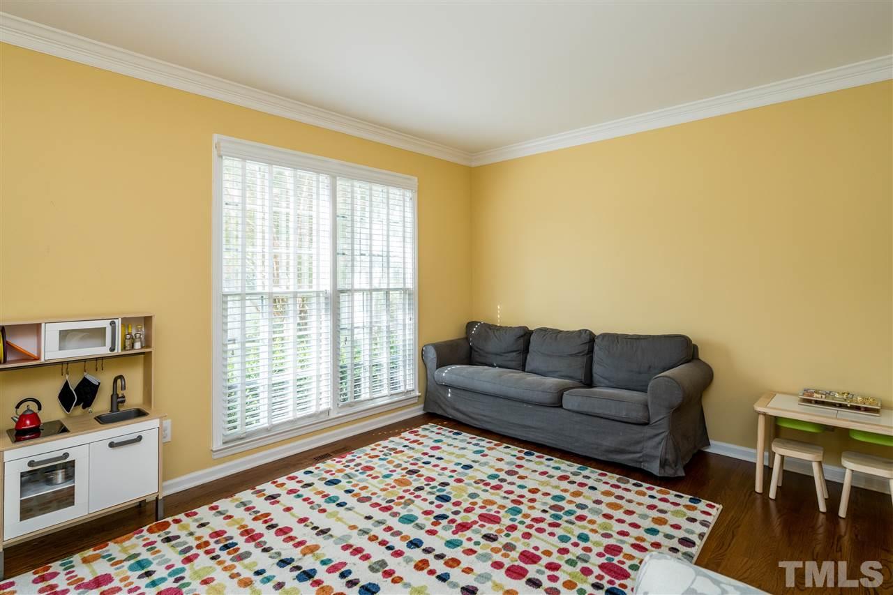 3316 Stone Castle Court Raleigh, NC 27613 - Photo 2 of 25 a living room with furniture and a window