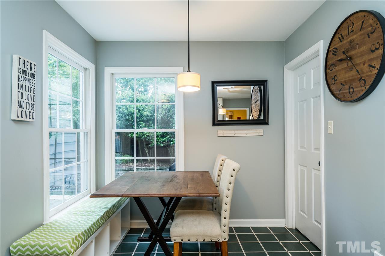 3316 Stone Castle Court Raleigh, NC 27613 - Photo 11 of 25 a view of a dining room with furniture and a window