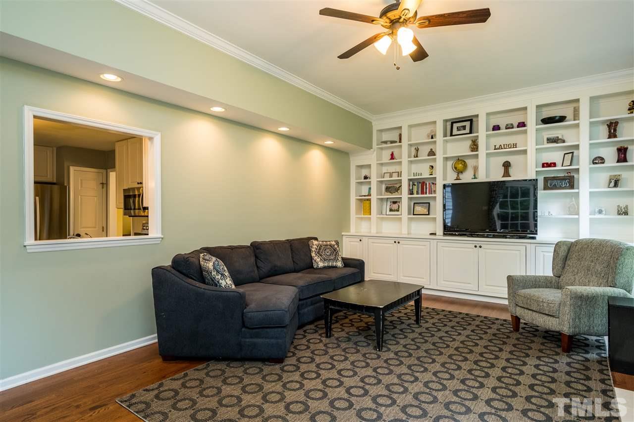 3316 Stone Castle Court Raleigh, NC 27613 - Photo 13 of 25 a living room with furniture and a flat screen tv