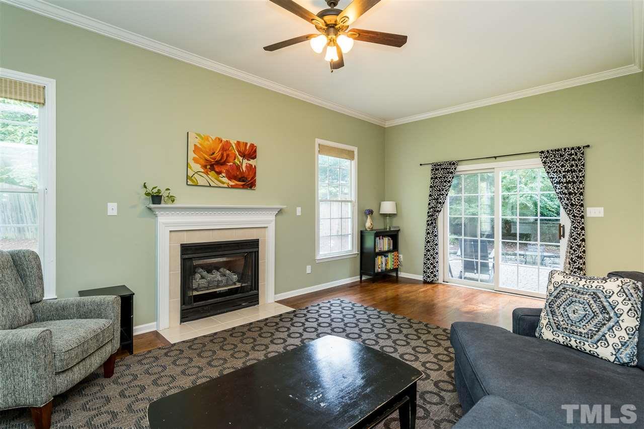 3316 Stone Castle Court Raleigh, NC 27613 - Photo 15 of 25 a living room with furniture and a fireplace