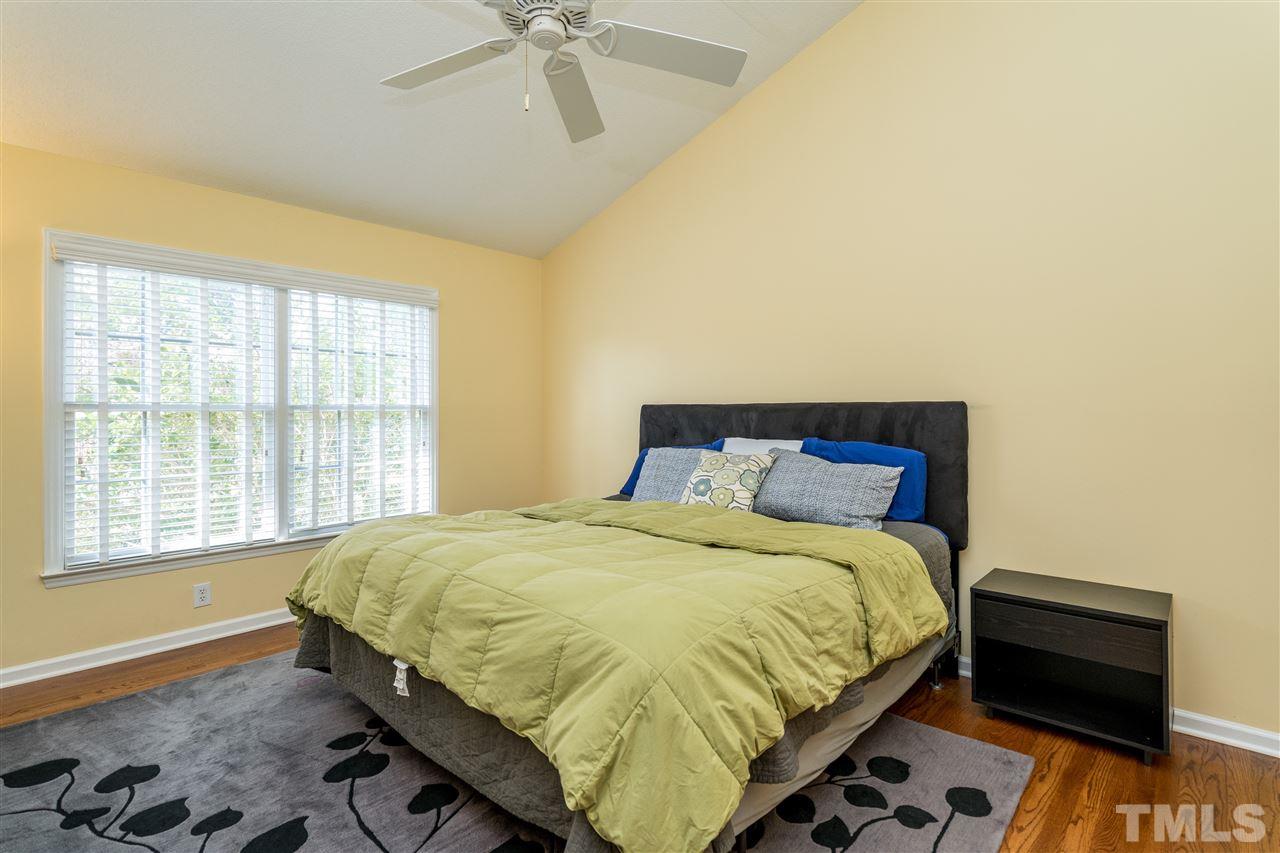 3316 Stone Castle Court Raleigh, NC 27613 - Photo 16 of 25 a bedroom with a bed and a window