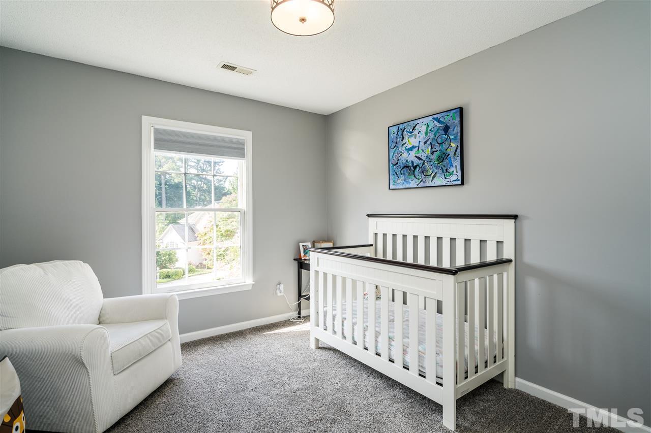 3316 Stone Castle Court Raleigh, NC 27613 - Photo 21 of 25 a bedroom with furniture and a window
