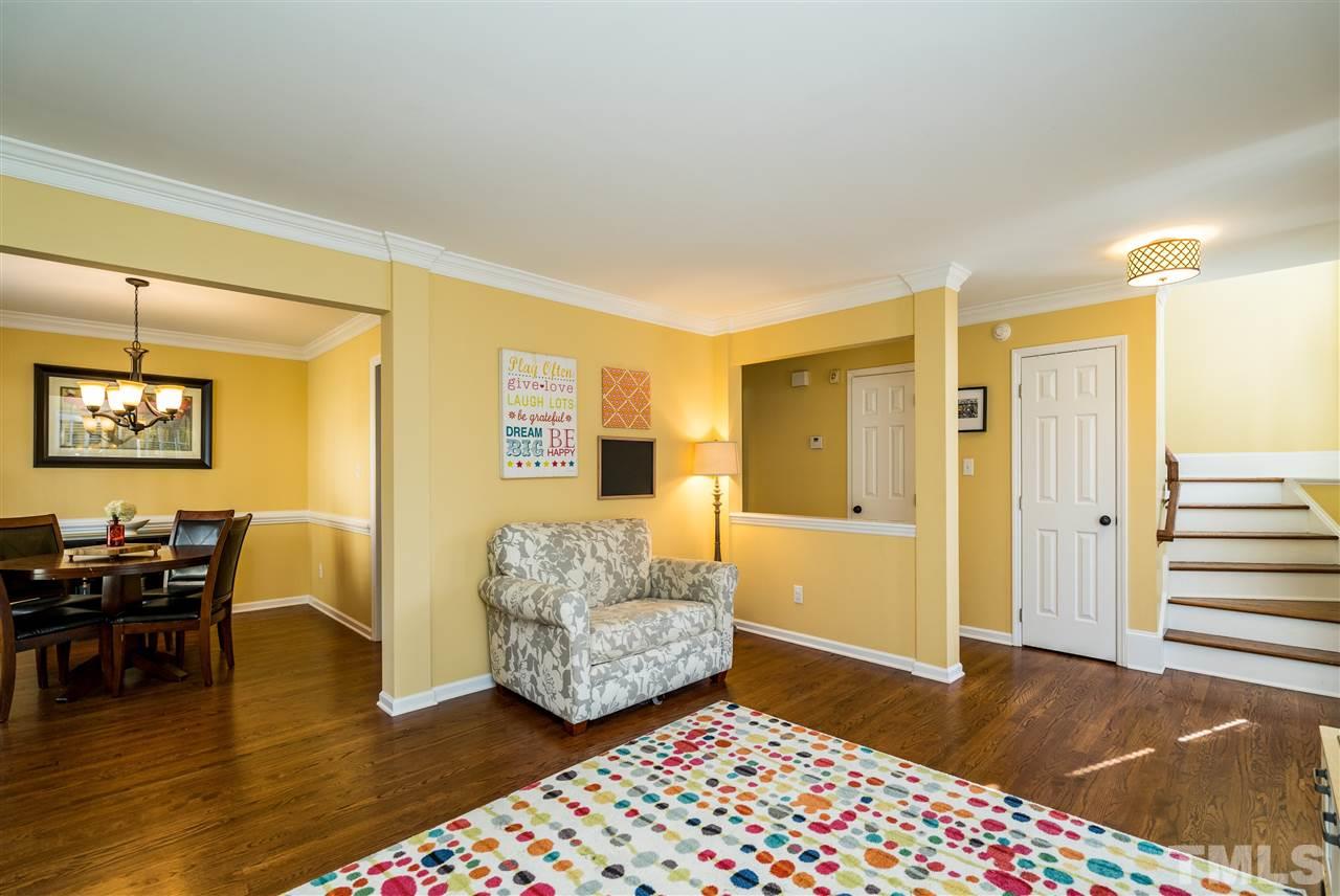 3316 Stone Castle Court Raleigh, NC 27613 - Photo 4 of 25 a living room with furniture and a wooden floor
