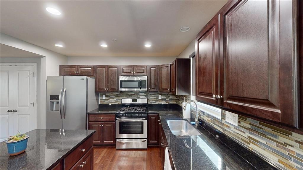 138 Watson Drive Warrendale, PA 15086 - Photo 3 of 24 a kitchen with stainless steel appliances a refrigerator and stove