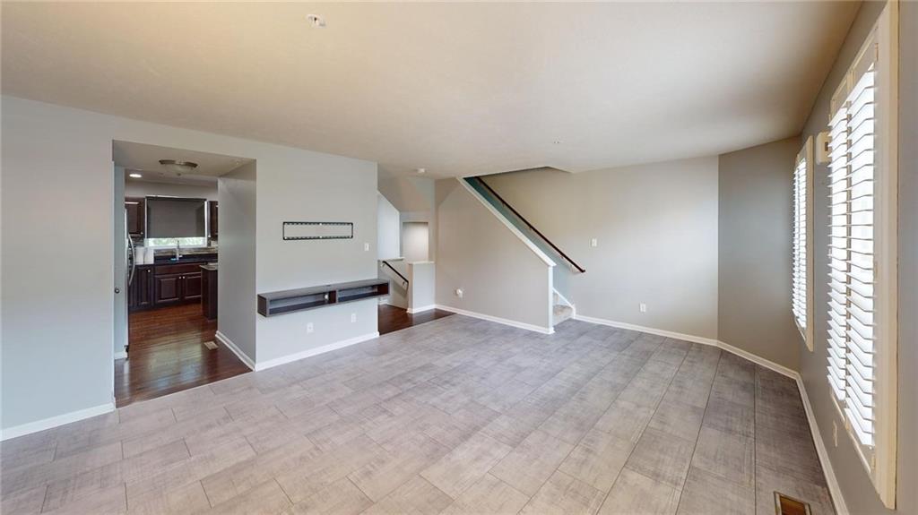 138 Watson Drive Warrendale, PA 15086 - Photo 8 of 24 an empty room with windows and entrance