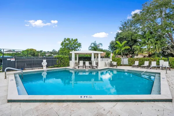 a view of swimming pool with seating space