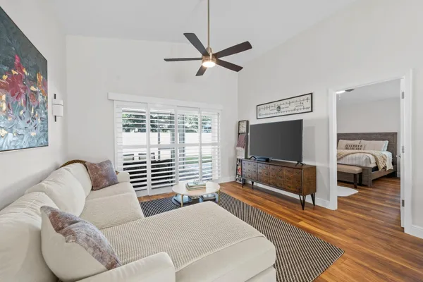 a living room with furniture and a flat screen tv