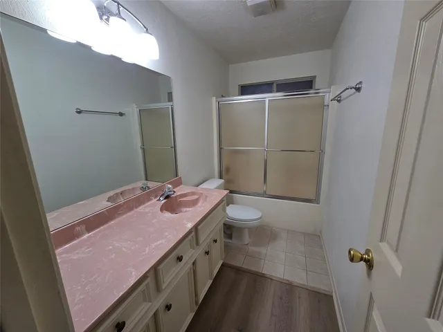 a view of balcony with wooden floor