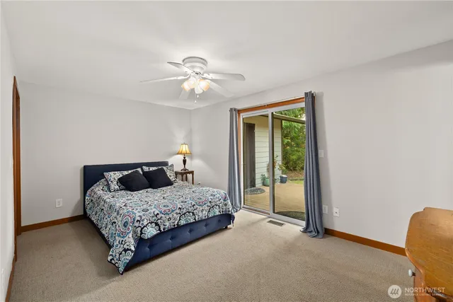 a view of a patio with couches table and chairs and potted plants