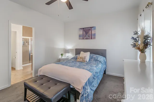 a bedroom with a bed and a table in it