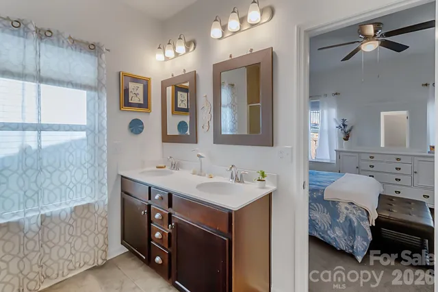 a bathroom with a sink double vanity and a mirror