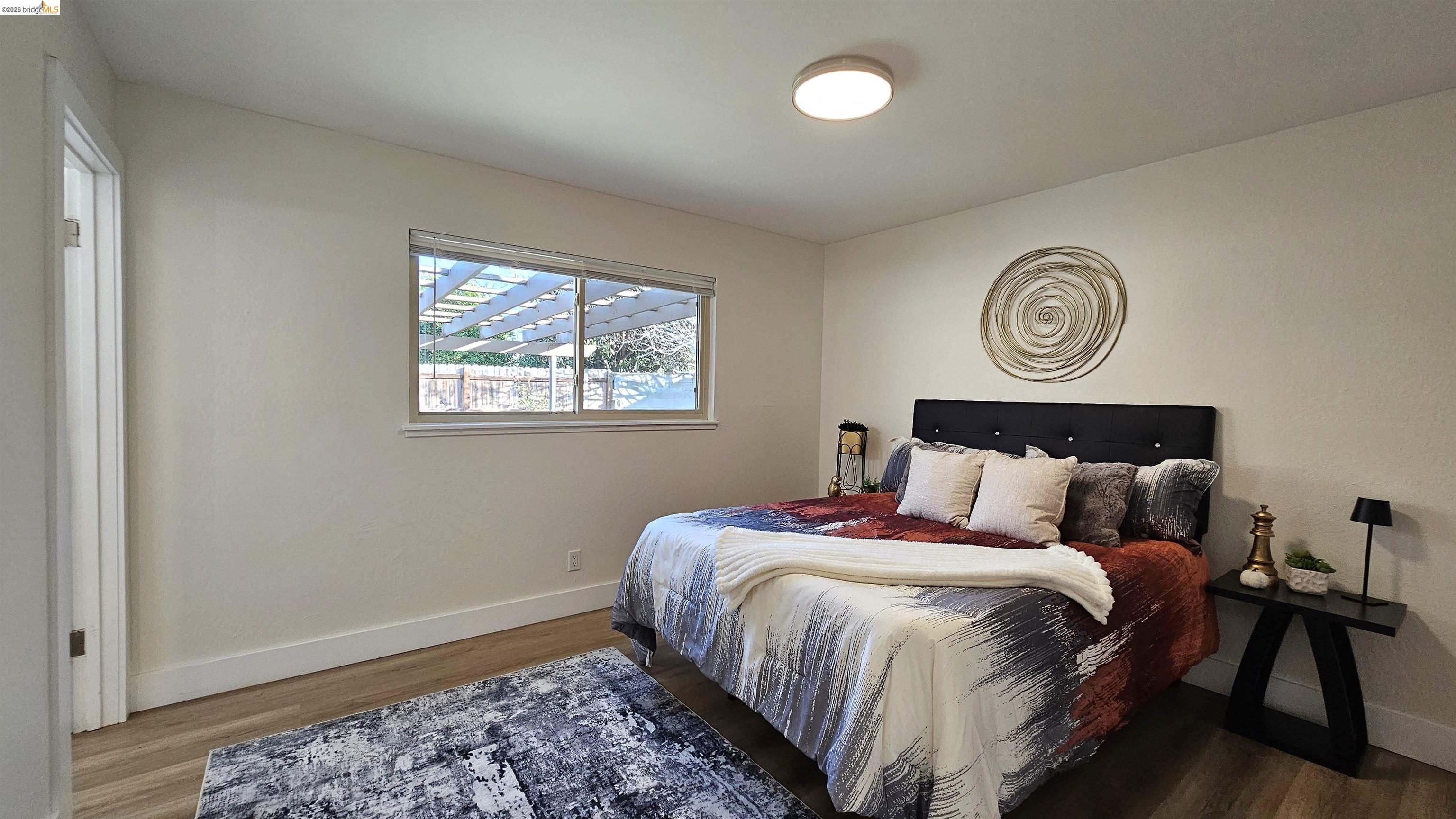 95 West Leland Road Pittsburg, CA 94565 - Photo 12 of 25 a bedroom with bed and a window