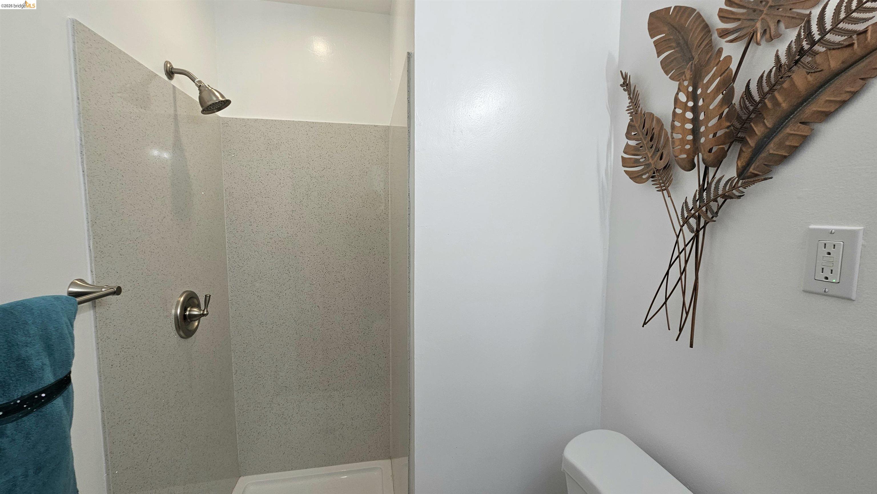 95 West Leland Road Pittsburg, CA 94565 - Photo 15 of 25 a bathroom with a toilet and a shower