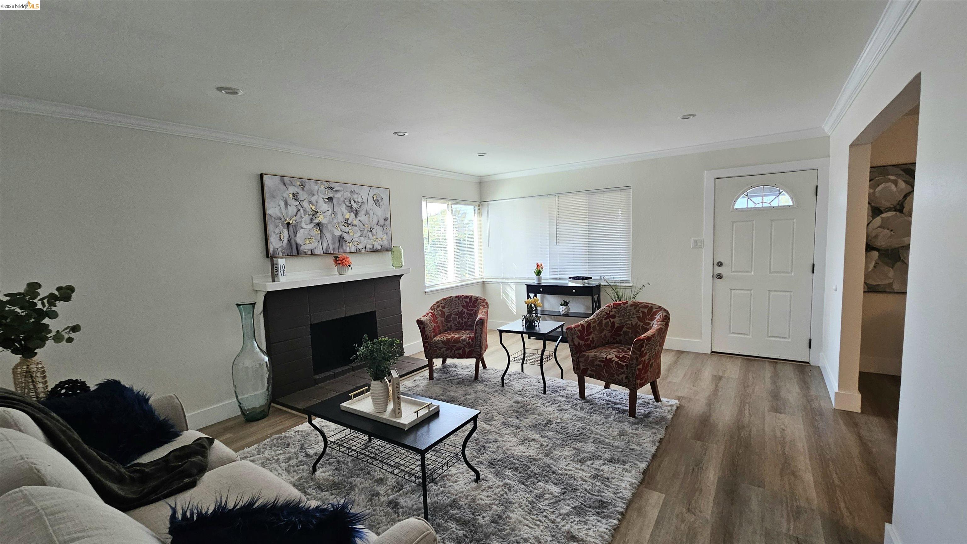 95 West Leland Road Pittsburg, CA 94565 - Photo 3 of 25 a living room with furniture and a fireplace